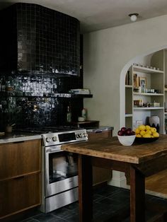 Here's a backsplash design renovators are loving: counter-to-ceiling tile, including on the vent hood.