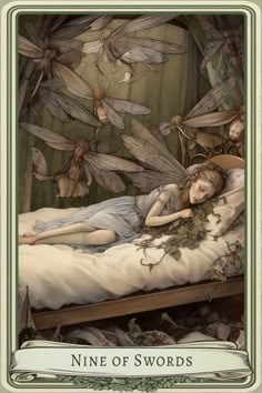 a fairy laying on top of a bed with lots of dragon wings flying above it