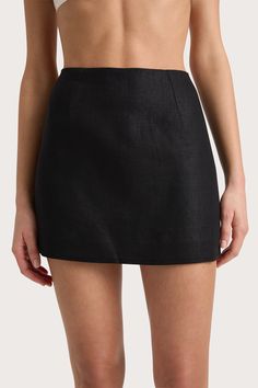 A classic mid-rise mini skirt that sits high on the hips. Designed from a signature 100% European Flax® linen fabrication in a black colourway, it features two darts in the front waist and crops short above the knees. It is also fully lined so will hold shape. Designed to be an effortless styling piece, wear under the Jane Vest and a simple sandal for elevated everyday wear. This style is true to size. Please note there is no elastic woven into the fabric so it does not offer any additional stre Black Mini Skirt Amazon, Black Mini Skirt Outfit Night Classy, Little Black Skirt, Cotton Mini Skirt, Plain Skirt, Short Black Skirt, Simple Sandals, Skirt Crop, Mini Skirt Black