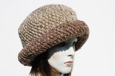 "Styl: warm winter cloche hat features a with a wide turn back brim.The perfect hat for autumn and winter days. Material: a mix of yarns of different structure and color. 20% wool, 80% acrylic Color:beige color hat on this auction but you will find other color options on my auctions.You can also compose your color set. Characteristics hat:chunky,soft,warm,unique Size:Head Circumference: 23\" - 24\" Height: 9\" A chunky, winter women's crochet hat.This hat is very elegant. Made from yarn of highe Beige Crochet Hat With Short Brim For Winter, Beige Crochet Hat With Curved Brim For Winter, Beige Curved Brim Crochet Hat For Winter, Brown Knit Beanie, Knitted Wide Brim Cloche Hat, Fall Cable Knit Hat, Knitted Wide Brim Cloche Hat For Winter, Winter Knitted Wide Brim Cloche Hat, Winter Wide Brim Knitted Cloche Hat