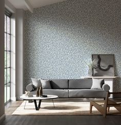 a living room filled with furniture and wallpaper