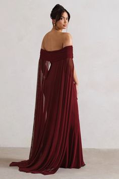 Exude an ethereal state of mind inCarlotta, our captivating cape maxi dress. Defined by a flowing chiffon cape, this berry maxi also boasts a timeless bardot neckline and floor length skirt. For the perfect wedding guest ensemble, style yours with a tousled bun and statement earrings.   Features  - Premium stretch jersey - Bardot neckline - Invisible zip closure  - Chiffon cape - Maxi length    Sizing & Fit  Model is 5'8 and wears UK size 8 / US size 4   Product Information     Double layered with good stretch  Premium jersey in Berry (95% Polyester, 5% Elastane)  155cm total length  SKU:CL131000037 Chiffon Cape, Bardot Neckline, Floor Length Skirt, Bridesmaid Outfit, Black Velvet Dress, Invisible Zip, The Perfect Wedding