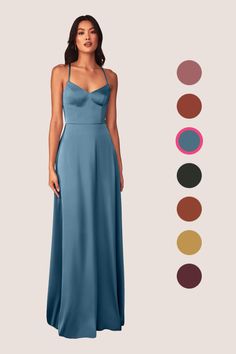 a woman in a long blue dress standing next to different color swatches and colors