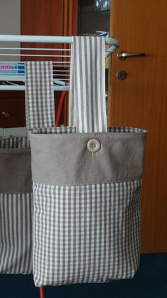 two gray and white bags sitting next to each other