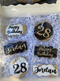 decorated birthday cookies in a box for someone's twenty year old son and sister