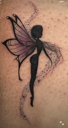 a woman's back with a fairy tattoo on it