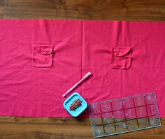 the table is covered with pink cloth and various items to make it look like they have been made out of fabric