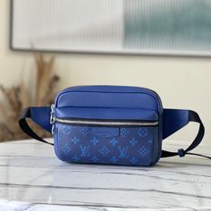 Blue Limited Edition Outdoor Waist Bag combines Monogram canvas and soft Taïga leather, using harmonious tones to outline modern lines. The internal structure is well-organized, and you can safely store your belongings while freeing your hands. 

Dimensions: 21.0 x 17.0 x 5.0 cm Modern Saffiano Leather Bag With Leather Trim, Modern Blue Belt Bag For Travel, Modern Blue Belt Bag For Everyday Use, Functional Blue Bags With Detachable Strap, Modern Pouch Bag With Leather Trim, Blue Rectangular Belt Bag For Travel, Modern Pouch Bags With Leather Trim, Blue Shoulder Bag With Leather Trim For Daily Use, Modern Leather Trim Pouch Bag