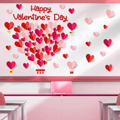 a valentine's day classroom with hearts on the wall and desks in front of it