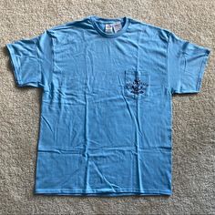 Brand New With Tags Pocket T-Shirt With Delray Beach, Florida, Anchor Design On The Pocket. 100% Cotton. Size Extra Large (Xl). I Accept Or Counter All Offers! Casual Summer T-shirt With Pockets, Casual Light Blue T-shirt For Summer, Blue Camp Shirt For Beach Vacation, Blue Casual Camp Shirt For Beach Season, Blue Cotton Camp Shirt For Beach Season, Blue Summer Shirt For Vacation, Blue Cotton T-shirt For Beach Season, Summer Tops With Pockets For Vacation, Blue Short Sleeve T-shirt For Beach Season