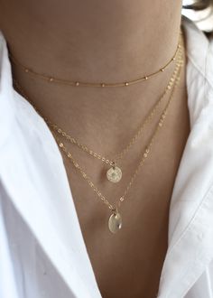 · 1/2" (12.7mm) disc· 14k yellow gold fill, 14k rose gold fill, and sterling silver options· Sturdy, timeless, and built to be worn everydayOur classic 1/2” necklaces are easy to layer, elegant, and ready to be personalized with your most special sentiments, moments, and memories! Created to last a lifetime, these necklaces will remain evergreen even as the years and trends come and go.Personalizing your piece with a message? Reference our fonts and symbols chart for font options and character m Minimalist Medallion Jewelry For Everyday, Dainty 14k Gold-filled Medallion Jewelry, Dainty 14k Gold Filled Medallion Jewelry, Everyday Sterling Silver Jewelry 14k Stamped, Everyday Rose Gold Medallion Jewelry, Adjustable 14k Gold Round Pendant Jewelry, 14k Gold Filled Yellow Gold Coin Pendant Jewelry, 14k Gold-filled Yellow Gold Coin Pendant Jewelry, Minimalist Hammered 14k Gold-filled Jewelry