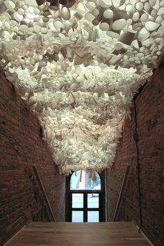 the ceiling is made up of many white objects