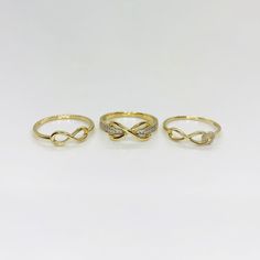 14k Solid Gold Infinity Sign CZ Beautiful Statement Ring II for Women Girl * Metal : Real 14K Yellow Gold * Condition : Brand New * Finish : Polished * Width : Style 1 (4.7mm) / Style 2 (6.6mm) / Style 3 (4.4mm) * Weight : Style 1 (1.3 gram) / Style 2 (2.1 gram) / Style 3 (1.3 gram) This is an approximate size & weight. Please expect up to ±10% difference. * Processing time : 1~3 business days * Ships from California This is 100% Authentic 14k Gold. Not plated or filled. All of our items are bra Gold Infinity Promise Jewelry, 14k Gold Infinity Jewelry With Diamond Accents, Gold Infinity Diamond Ring, Gold Infinity Promise Stackable Rings, Gold Infinity Diamond Ring Gift, Infinity Jewelry With Diamond Accents For Promise, Infinity Promise Jewelry With Diamond Accents, Infinity Shaped Promise Jewelry With Diamond Accents, Gold Infinity Diamond Ring For Wedding