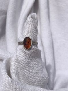 Sterling Silver Amber Ring Size 8 1/4. Simple bezel and band. Classic Adjustable Oval Jewelry, Classic Oval Cabochon Jewelry For Everyday, Adjustable Oval Stackable Rings With Polished Finish, Vintage Adjustable Rings For Everyday, Adjustable Cabochon Rings For Formal Occasions, Adjustable Bezel Set Ring For Formal Occasions, Formal Rings With Bezel Setting, Nickel Free Oval Rings For Everyday, Nickel-free Oval Rings For Everyday