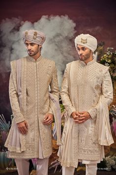 Make a grand statement on your special day with a luxurious Sherwani crafted from premium fabrics (like silk, brocade, or georgette) for ultimate comfort and sophistication. Our collection boasts a variety of designs to suit every taste: Classic elegance: Opt for a timeless Sherwani with intricate embroidery on the collar or cuffs. Modern flair: Go for a Sherwani with a unique neckline or a trendy color palette. Regal opulence: Choose a Sherwani with rich embellishments like zardozi work for a t Sarwani For Men Wedding, Reception Sets With Naqshi In Traditional Drape, Brocade Sherwani With Naqshi For Diwali, Diwali Brocade Sherwani With Naqshi Details, Diwali Brocade Sherwani With Naqshi, Embroidered Traditional Fit Sherwani For Wedding, Wedding Traditional Wear In Jamawar With Naqshi, Wedding Traditional Wear With Naqshi In Jamawar, Gold Traditional Wear With Naqshi For Wedding