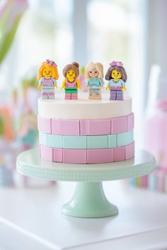 a cake with lego figures on top of it