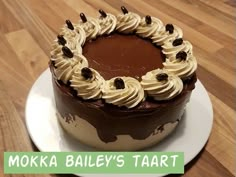 there is a cake on the table with words moka bailey's tart