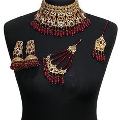 Pakistani jewellery set. Set includes - Earrings  Necklace  Tikka Jhumar Red Bollywood Jewelry Sets With Latkans, Red Bollywood Bridal Necklace With Latkans, Red Kundan Bridal Necklace With Latkans, Red Bollywood Jewelry With Stone Work, Wedding Jewelry Sets With Stone Work Choker, Wedding Choker Jewelry Sets With Stone Work, Red Temple Jewelry Choker For Wedding, Red Choker Jewelry For Wedding, Red Temple Jewelry Wedding Choker