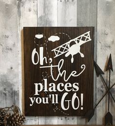 a wooden sign that says, oh the places you'll go with an airplane on it