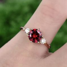 "This is a 1.25 carat garnet engagement ring in solid gold,about 7mm round cut. The accent stones are moissanites,forever classic quality. It can be made in any ring size. However please contact me to custom make it to a special big or small size. It can be made in white gold,rose gold or yellow gold with 14k or 18k. However for some people who are nickel allergic,I can also make it to 925 sterling silver to make you can wear it. The ring is handmade,very high quality! 30 days money back guarant Marquise Ring Setting, Gold Garnet Ring, Garnet Ring Vintage, Garnet Engagement Ring, Quartz Engagement Ring, Bridal Wedding Rings, Diamond Ring Settings, Garnet Ring, Garnet Rings