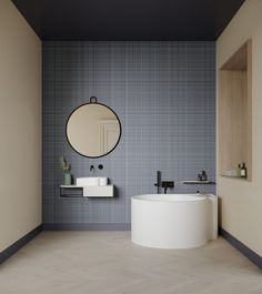 a bathroom with two sinks and a round mirror