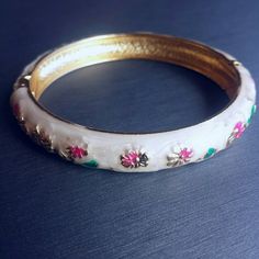 White enamel clasp bracelet bangle NEW. Pretty floral white enamel painted bangle with gold tone trim. Painted with pink and green flowers. Clasp closure. Diameter = 2.4 inches. Jewelry Bracelets Pink And Green Flowers, Clasp Bracelet, Floral White, Bracelet Clasps, Bracelet Bangle, White Enamel, Style Jewelry, Green Flowers, Womens Jewelry Bracelets