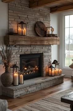 a living room with a fire place filled with candles