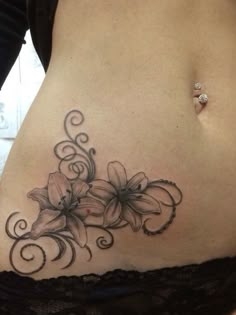 a woman's stomach with flowers on it