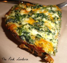 a slice of quiche with spinach and cheese