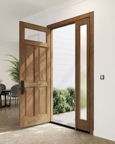 an open wooden door in a white room