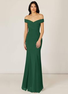 a woman in a long green dress