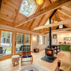 a living room filled with furniture and a fire place in the middle of a room