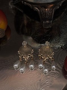 Become the Diamond of the Season with these Regency Inspired Bee Cameo Earrings! Gold-toned hardware, ivory enamel, bee cameos, and faux pearl teardrop dangles complete this Bridgerton-Inspired pair of earrings, for you to accessorize with. Sizing: Length 1.5 Inches / 1.75 CentimetersWidth 1 Inch / 2.5 Centimeters Diamond Of The Season, Fantasy Shop, Bridgerton Inspired, Cameo Earrings, Medieval Fashion, Edwardian Fashion, Baroque Fashion, Curated Vintage, Victorian Fashion