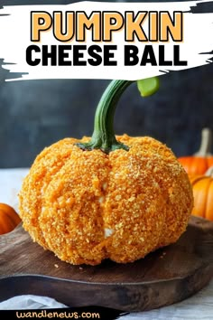 a pumpkin cheese ball sitting on top of a wooden cutting board with the words pumpkin cheese ball above it