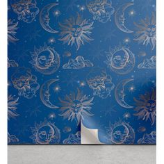 a blue wallpaper with stars and moon designs