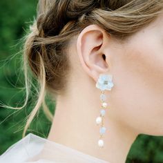 Dream of feather-light blooms and a warm summer breeze. These flower earrings are made with small gold beads and real hydrangea petals. These delicate hydrangea flower petals are layered on a silver post (with pushback) with golden embellishment in the center. Small freshwater pearls and light blue beads hang delicately on a matching gold chain. /All the flowers have been properly dehydrated before being coated/cast in resin so that the color stays fresh-looking for seasons/ Spring Wedding Pearl Drop Jewelry, Handmade Flower Earrings For Spring Wedding, Spring Wedding Jewelry With Petal Design, Dainty Flower Earrings For Spring Wedding, Dainty Spring Wedding Flower Earrings, Dainty Spring Flower Earrings For Wedding, Elegant Blue Birth Flower Earrings, Spring Wedding Flower Charm Earrings, Delicate Blue Flower Earrings For Wedding