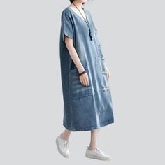 Introducing our 2023 Spring-Summer Collection: the Laid-back Distressed Denim Dress! Perfect for a day out with friends or a music festival. this stylish dress is the ultimate expression of distorted elegance. Crafted from premium quality denim. it's made to last!Key Highlights: Grunge Galore: Inspired by the iconic '90s grunge movement. this dress exudes an effortlessly cool attitude. Distinctive Distressed Pattern: Expertly crafted wear and tear. capturing a raw. unfiltered essence. Sleek Slim Light Wash Cotton V-neck Denim Dress, Casual Short Sleeve Denim Midi Dress, Casual Short Sleeve Denim Blue Midi Dress, Spring Trendy V-neck Denim Dress, Summer Distressed Cotton Denim Dress, Distressed Medium Wash Denim Dress For Summer, Summer Distressed Medium Wash Denim Dress, Casual Denim V-neck Dress, Relaxed Fit Denim Dress With Frayed Hem