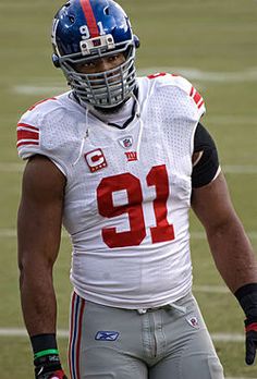 a close up of a football player on the field