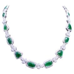 An exclusive design, so refined and glamour , a very piece of art, by Italian designer. Necklace come in 18k gold with 14 pieces of natural untreated Jades , excellent quality, of 18.68 carats, from Myanmar, in cabochon cut, in amazing green , and 991 pieces of natural diamonds of 7.66 carats, F color and VS clarity. It is a high jewels piece. Handcrafted by artisan goldsmith. Excellent manufacture and quality. Complete with AIG report. Length is about 18 inches, but it is resizable on request. Whosale price. Note: on my shipment, customers not pay taxes. Green Diamond Necklace For Formal Occasions, Formal Green Hallmarked Diamond Necklace, Luxury Pear-shaped Emerald Gemstone Necklace, Exquisite Pear-shaped Emerald Necklace For Formal Occasions, Elegant Baguette Cut Emerald Necklace For Formal Occasions, Elegant Baguette Cut Emerald Necklace For Formal Events, Dazzling Formal Emerald Gemstone Necklace, Pear-shaped Emerald Gemstone Necklace For Formal Occasions, Pear-shaped Emerald Gemstone Necklace For Formal Events