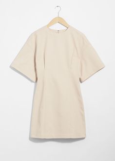 Mini dress featuring short, wide sleeves and a fitted waistline.• Round neckline• Length of dress:85.5cm / 33.7" (Size S) Cream Mini Dress, Summer Style Guide, Knit Outerwear, Linen Sweater, Dress Cream, Short Sleeve Mini Dress, Spring Summer 2024, Fashion Story, Cream Dress