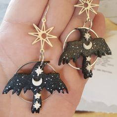 Asymmetrical Celestial Raven Earrings Mismatched Raven - Etsy Artistic Resin Dangle Jewelry, Handmade Black Magical Jewelry, Handmade Magical Black Jewelry, Handmade Symbolic Black Earrings, Unique Pierced Polymer Clay Earrings, Unique Pierced Resin Earrings, Unique Polymer Clay Jewelry With Ear Wire, Whimsical Black Jewelry For Gifts, Artistic Polymer Clay Jewelry For Crafting