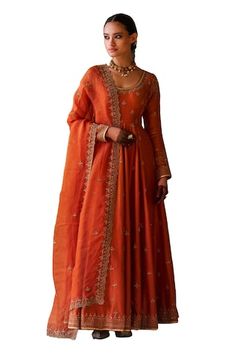 Rust chanderi anarkali with dori and aari hand embroidery. Comes with pant and an organza dupatta. - Aza Fashions Chanderi Anarkali Set For Navratri Wedding, Chanderi Anarkali Set For Wedding And Navratri, Navratri Wedding Chanderi Anarkali Set, Wedding Slub Silk Anarkali Set With Dabka Work, Wedding Slub Silk Lehenga With Dabka Work, Wedding Lehenga In Slub Silk With Dabka Work, Designer Floor-length Anarkali Set With Zari Work, Semi-stitched Slub Silk Anarkali Set With Dori Work, Semi-stitched Anarkali Set With Dori Work In Slub Silk