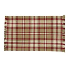 a red and white plaid blanket with fringes