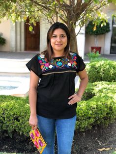 "We know there is no fiesta without the right outfit. This beautiful mexican blouse is handmade embroidered. So colorful and vibrant flowers. Will be perfect for your summer fiestas, or any boho-hippie style. Made of cotton Size: one size fits all Measurements: 17\" x 26\" This listing is for one BLACK mexican embroidered blouse All orders are shipped using Mexican Postal Service and it takes: 15-25 bussines days (North America). 20-30 bussines days (Europe). 20-35 bussines days (Rest of the wor Fiesta Tops With Floral Embroidery, Multicolor Embroidery Tops For Fiesta, Cotton Embroidered Top For Fiesta, Embroidered Tops For Cinco De Mayo Festival, Multicolor Embroidered Tops For Cinco De Mayo Fiesta, Embroidered Fiesta Blouse, Spring Fiesta Embroidered Top With Embroidered Neckline, Summer Fiesta Top With Geometric Embroidery, Summer Fiesta Tops With Embroidered Neckline