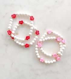 I ❤️ LOVE! The sweetest candy heart bead bracelets. Choose between pink or red hearts. Or a mix! All pieces include 14k gold or silver plating. All bracelets are FINAL SALE as these are custom orders. Please double check your bracelet size and consider the additional ½ inch increase for optimal comfort fit. CARE INSTRUCTIONS: -Avoid contact with water to improve longevity. -Roll bracelets onto your wrist to avoid over stretching. -If you are ordering a piece for a child, ALWAYS supervise while w Handmade White Bracelets For Best Friend, Sweet White Jewelry For Valentine's Day, Adjustable White Bracelets For Best Friend Gift, Cute Hypoallergenic Beaded Friendship Bracelets, Customizable White Bracelets For Friendship, Sweet Personalized Bracelets As Gift, Cute Bracelets For Mother's Day, Personalized Sweet Bracelets As Gift, Friendship Letter Bead Charm Bracelet For Valentine's Day