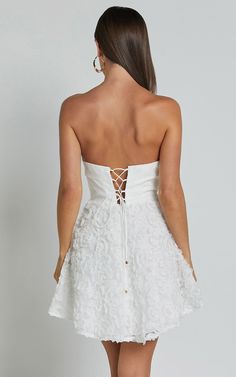 Violeta Mini Dress - Strapless 3d Floral Dress in White | Showpo USA Spring Wedding Dress With Lace-up Back, Strapless Mini Dress With Lace Bodice For Spring, Strapless Mini Dress With Lace Bodice For Wedding, Spring Homecoming Strapless Dress With Fitted Bodice, Strapless Dress With Fitted Bodice For Spring Homecoming, Spring Wedding Corset Dress With Lace-up Back, Strapless Floral Applique Spring Dress, Strapless Spring Dresses With Floral Applique, Strapless Floral Applique Dress For Spring