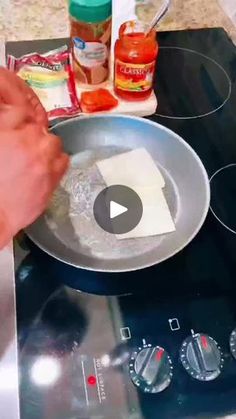 someone is cooking something in a pan on top of the stove with an electric burner