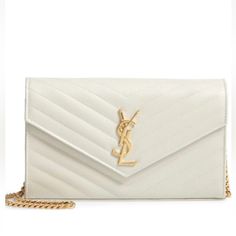 Indulge In Luxury With This Stunning Yves Saint Laurent Envelope Chain Purse. The Cream-Colored Leather Exterior Is Embossed And Quilted In A Chevron Pattern, Beautifully Accented By Gold Hardware And A Gold Chain Strap. This Shoulder Bag Features A Snap Closure And A Rectangle Shape, Perfect For Carrying All Your Essentials. Inside, The Black Lining Adds A Touch Of Sophistication While The Brand Card And Original Box And Dust Bag Provide Authenticity. Ideal For Any Occasion, This Saint Laurent Bag Is A Must-Have For Any Woman's Collection. Luxury Formal Wallet On Chain In Envelope Shape, Luxury Envelope Wallet On Chain For Formal Occasions, Luxury Formal Envelope Wallet On Chain, Elegant Formal Envelope Wallet On Chain, White Chic Wallet On Chain For Formal Occasions, Chic White Wallet On Chain For Formal Occasions, Elegant White Wallet On Chain For Formal Occasions, Classic White Wallet On Chain For Formal Occasions, White Luxury Wallet On Chain For Formal Occasions