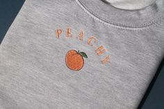 #etsy shop: Peachy Jumper, Embroidery, Peach, Sweatshirt, Embroidered, Fruit, Grey, Gift, Nature, Lounge wear, Summer Top, Unisex Clothing, Gift for her https://etsy.me/2yNzXaE #Peachy #design #Vintage #Peach #minimalist #pullover #chic #French #Summer #Fruit #retro Peach Embroidery Pattern, Mothers Day Embroidery, Peach Sweatshirt, Embroidered Fruit, Jumper Embroidery, Embroidered Jumper, French Summer