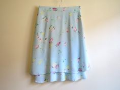 "Sky Blue Skirt Floral Print Skirt A Line Knee Skirt Floral Print Skirt Summer Skirt Light Blue Skirt Medium Size Label size: EUR 36/38 Measurements: (taken laying flat): Waist: 15\" / 38cm Hips: 20\" / 51cm Length: 25\" / 63.5cm Condition: great Vintage Condition Please check measurements to insure a proper fit. Remember to allow yourself some extra room for movement. You can compare these with something from your closet that fits you well. SHIPPING * I ship worldwide via Priority mail. * I shi Light Blue Flowy Mini Skirt, Light Blue Tiered Skirt With Lining, Flowy Light Blue Tiered Mini Skirt, Light Blue Flowy Tiered Mini Skirt, Light Blue Lined Mini Skirt, Fitted Light Blue Tiered Skirt, Light Blue Mini Skirt With Lining, Light Blue Lined Skirt For Summer, Blue Tiered Flowy Skirt